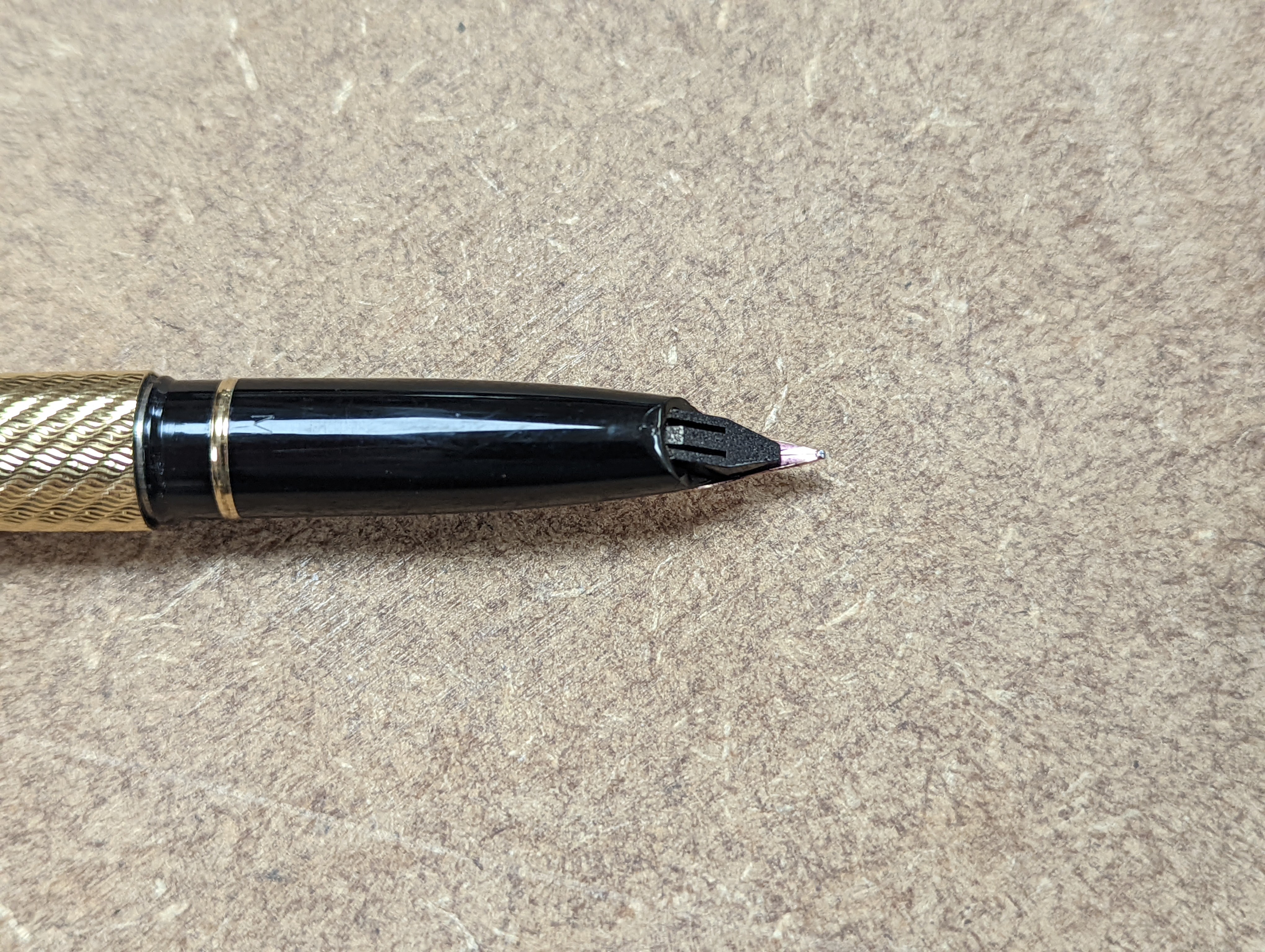 A cased gold plated Shaeffer fountain pen.